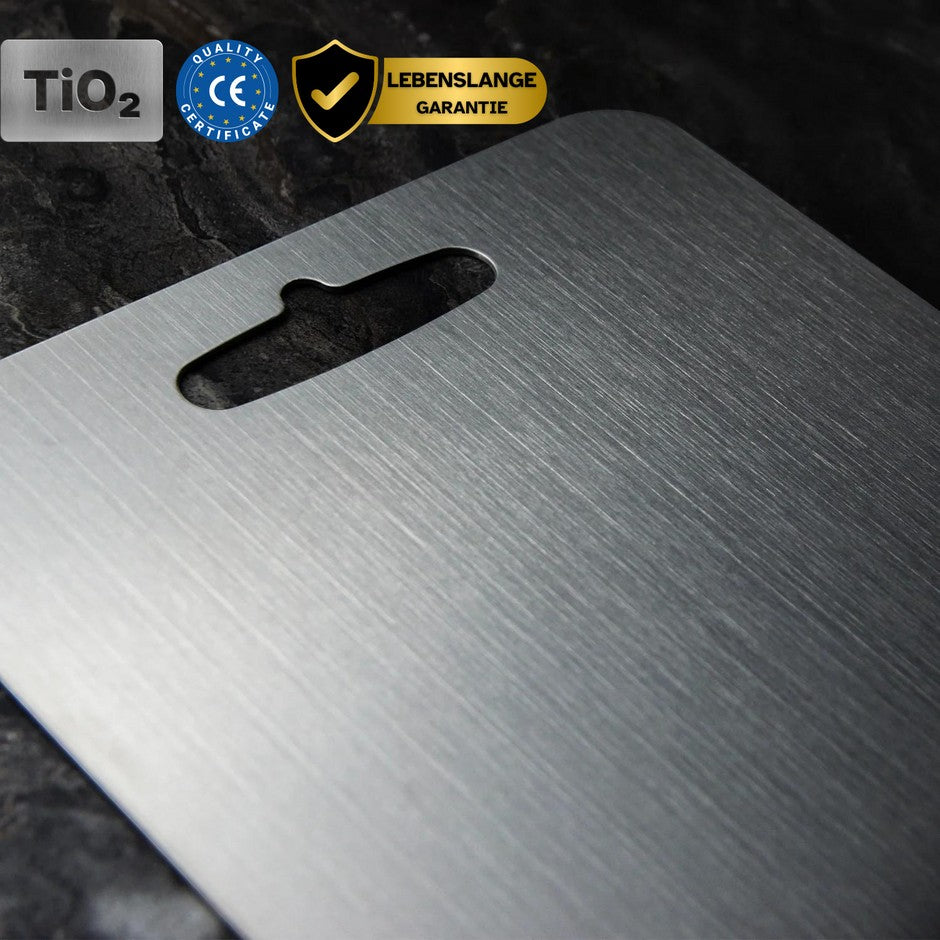 Knightsax Privateer 

® Titanium cutting board with hanging hole. Silver, medical-grade metal, antibacterial, and knife-friendly.